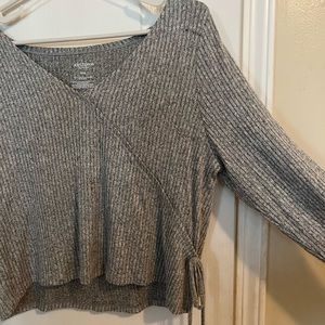 Grey long sleeve sweater like shirt with bow on the side